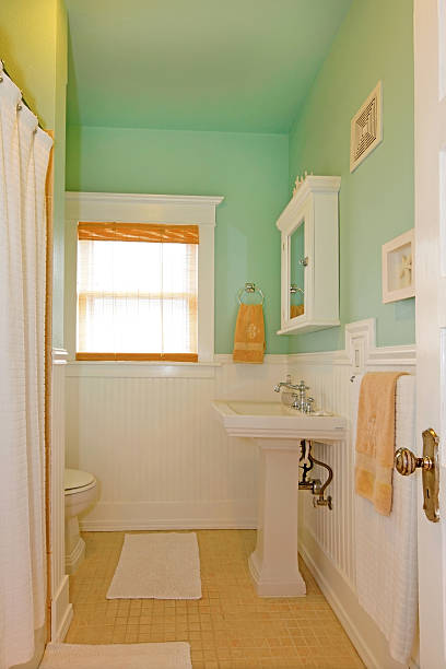 istock Small green bathroom with white sink. 494522093