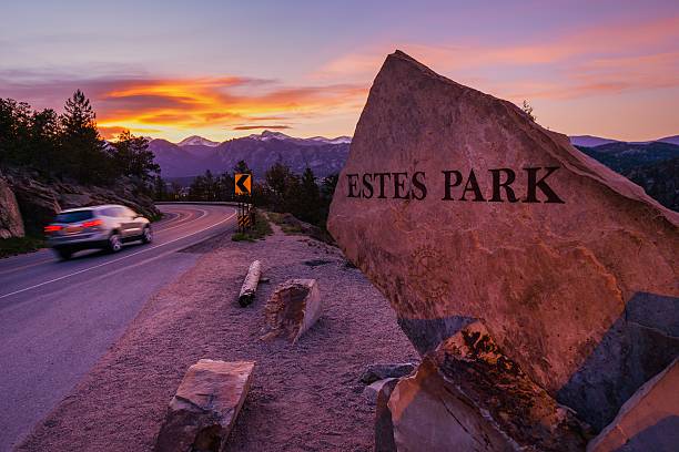 Estes Park Estes Park. Highway 36 Entrance Sign at Sunset. Estes Park, Colorado, United States estes park stock pictures, royalty-free photos & images