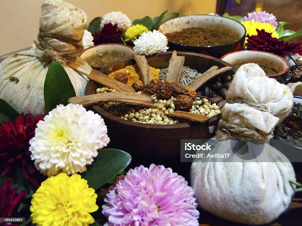 Spa spices Dofferent herbs for spa treatment in bowls Aromatherapy Stock Photo