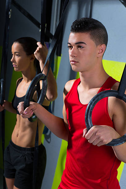 istock gym dip ring man and woman relaxed after workout 494525247