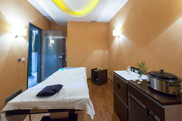 istock Massage room with hot stone heater 494525683