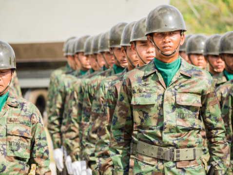 Chonburi, Thailand - January 18, 2014: Group of marine performing military parade of Royal Thai Navy at Sattahip Naval Base, Chonburi, Thailand