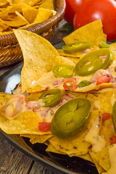 istock heaping pile of nacho chips with cheese 494527115