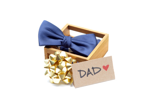 Close up of a bow tie in a box with a bow for Father's Day.
