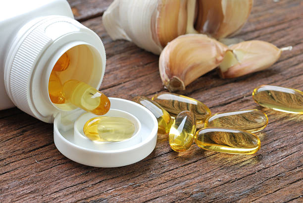 Garlic oil capsules/pills stock photo