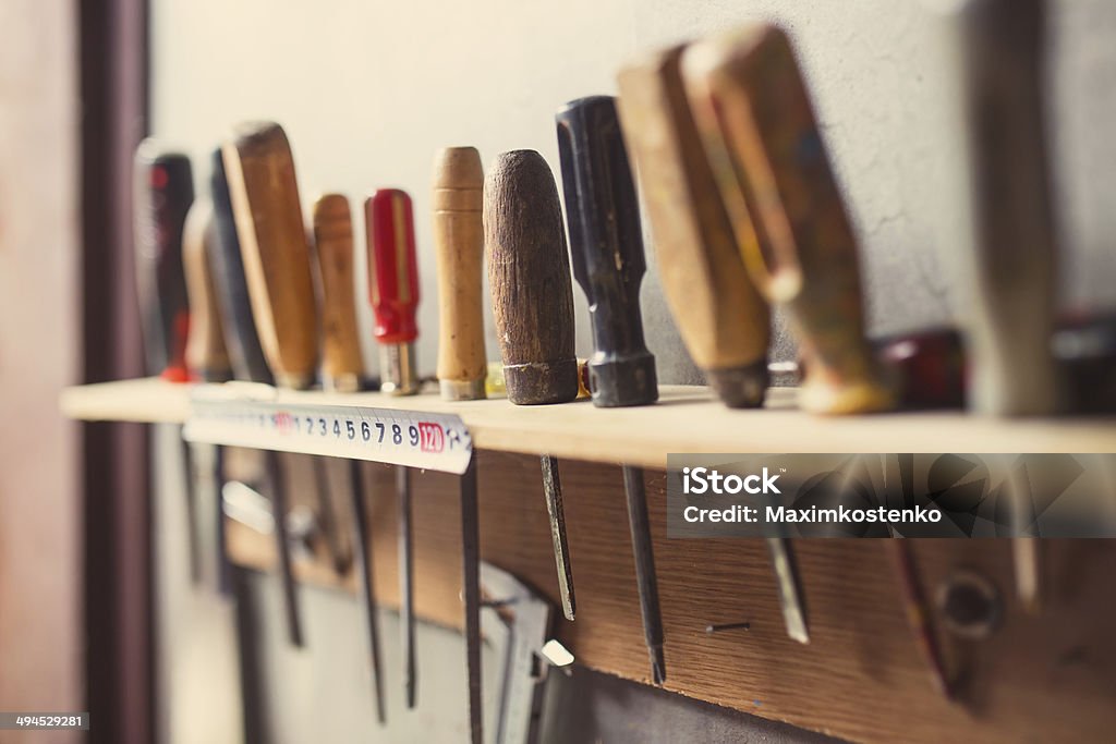 Old woodworking tools on wall, retro tinted Art And Craft Stock Photo