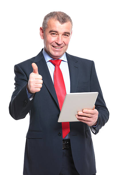 istock business man with tablet shows thumb up 494529807
