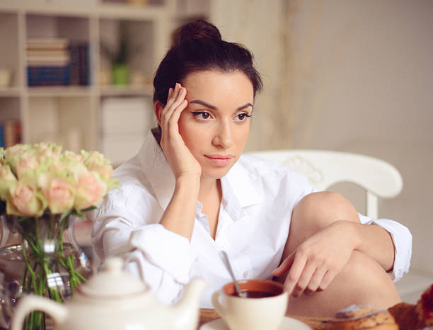 istock young woman having breakfast 494532500