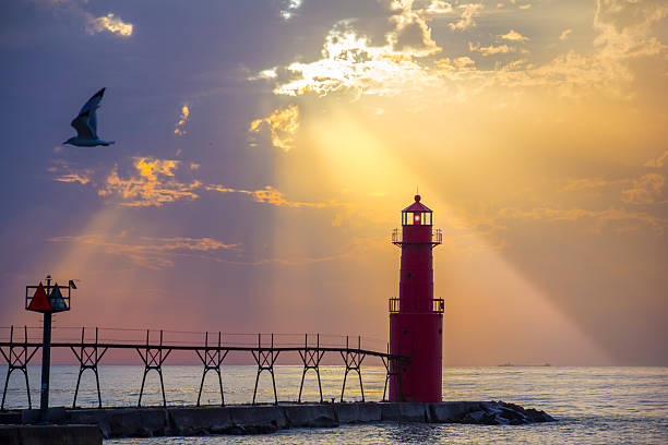 istock Sunrise Sunburst over Scenic Lighthouse on Great Lakes 494533236