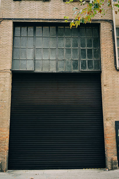 istock Part of black painted blind garage. Empty 494533250