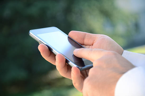 istock Close up of a man using mobile smart phone 494533418