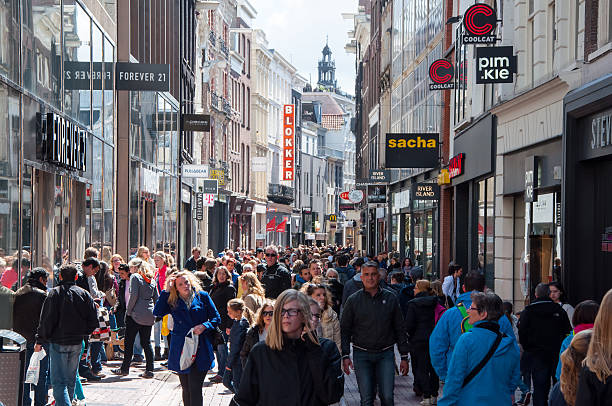Undefined people on Kalverstraat shopping street, the Netherlands. stock photo