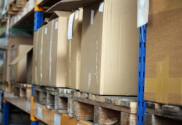 Cardboards with products in the big warehouse stock photo
