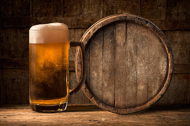 istock Beer barrel with  glass on table  wooden background 494534418