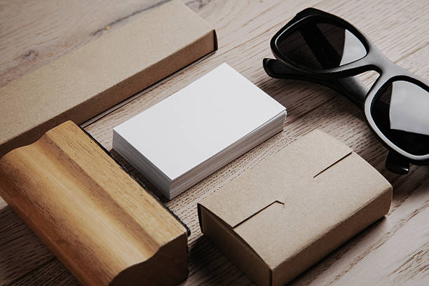 Set of  branding elements on the natural wood on a background. Black sunglasses