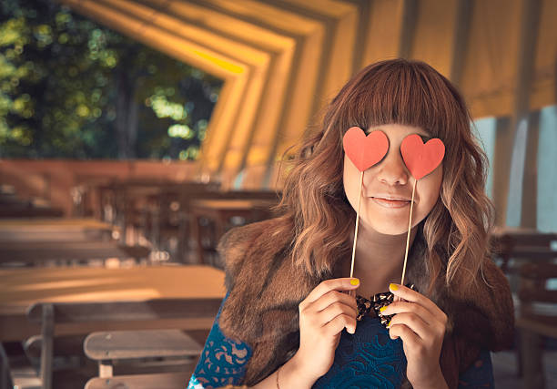 istock Young happy woman holding two hearts 494536128