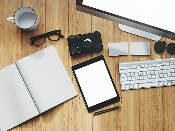 istock Photo of modern workspace with desktop screen, tablet, camera, keyboard 494536384