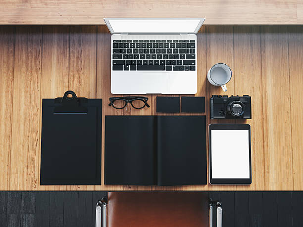 istock Generic design laptop on the wooden table with business objects 494536598