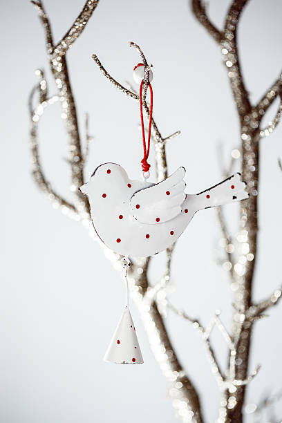 istock Christmas Vintage Toy Bird on a Silver Branch 494537248