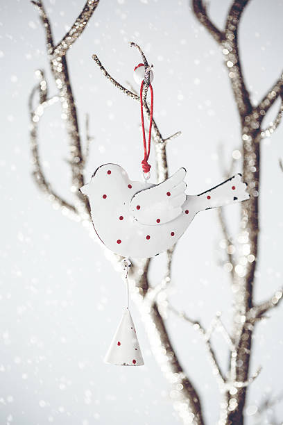 istock Christmas Vintage Toy Bird on a Silver Branch 494537564