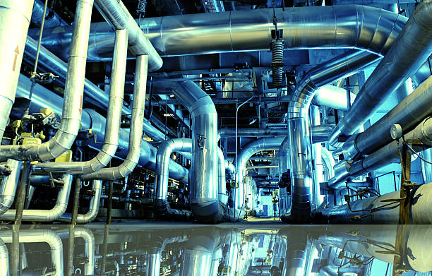 Industrial zone, Steel pipelines in blue tones with reflection stock photo