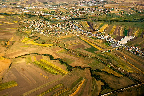 Photo from air fields photo from the bird's flight, fields and houses. the river and the road pristina stock pictures, royalty-free photos & images