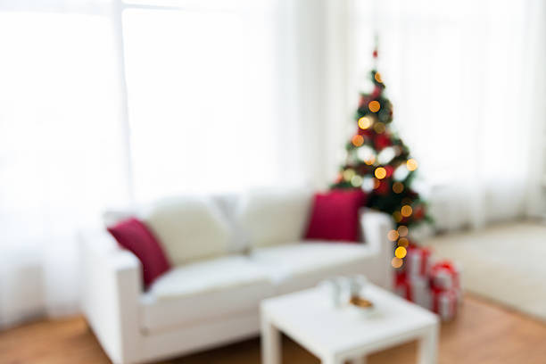 istock blurred living room with christmas tree background 494538142