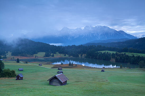 istock wooden hut on alpine meadows in morning 494538780
