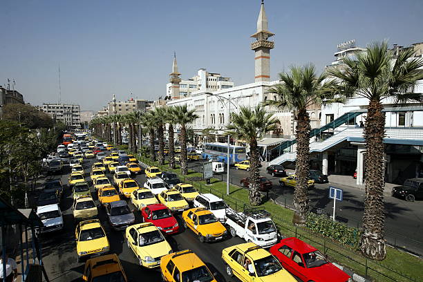 Car traffic with traffic jams in the capital of Syria and big city of Damascus in the overview, Syria