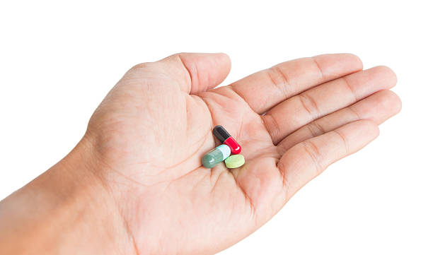 istock pill in male hand 494539690