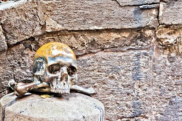 skull on the outside wall of Santa Maria delle Anime del Purgatorio Church in Naples, Italy.