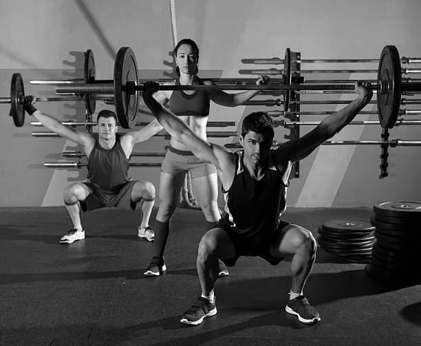 istock Barbell weight lifting group workout exercise gym 494541955
