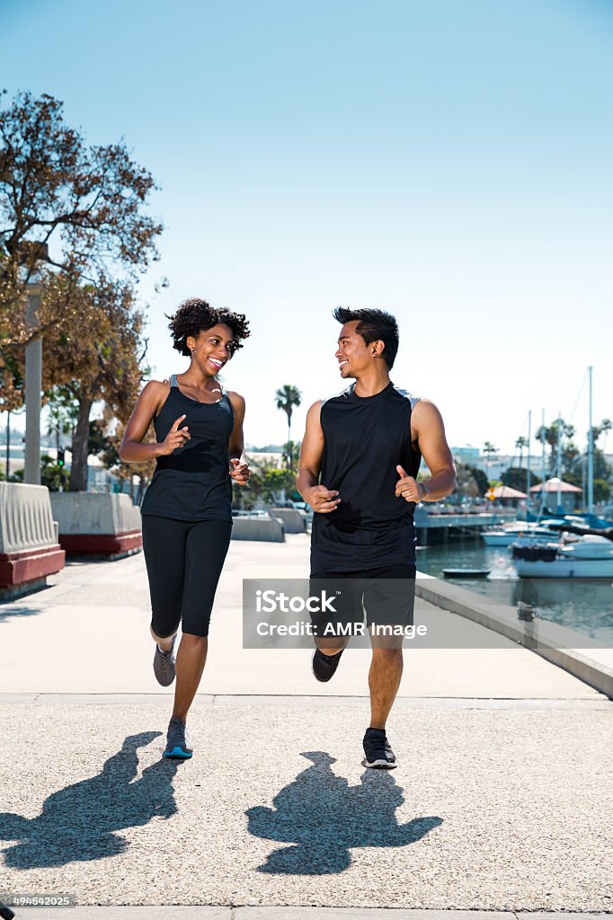Urban Fitness A couple exercising in an urban environment. 20-29 Years Stock Photo