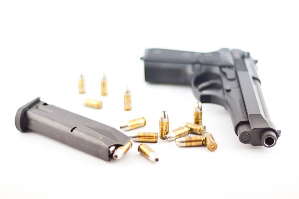 Gun and bullet isolated. Gun and bullet isolated. forty five caliber handgun stock pictures, royalty-free photos & images