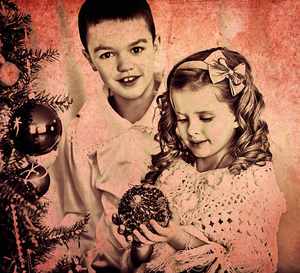 istock Children decorate on Christmas tree 494543030