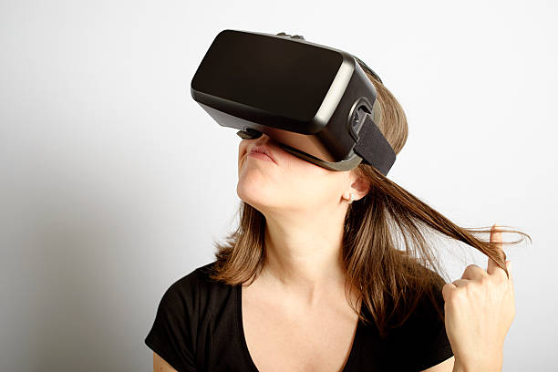 istock Woman Making Decisions Wearing Virtual Reality Headset 494544328