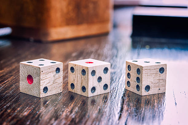 istock Wooden dices on  a old wood  floor 494544873