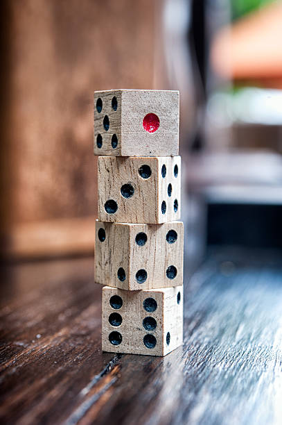 istock Wooden dices on  a old wood  floor 494544879