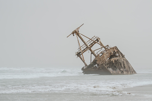 old phantom ship on the beach in the fog