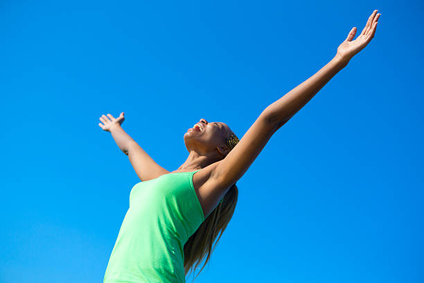 istock Woman with her Arms Raised 494557375