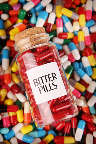 Bitter pills on pill background