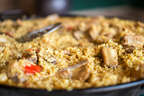 istock Paella pan with yellow rice and chicken 494558186
