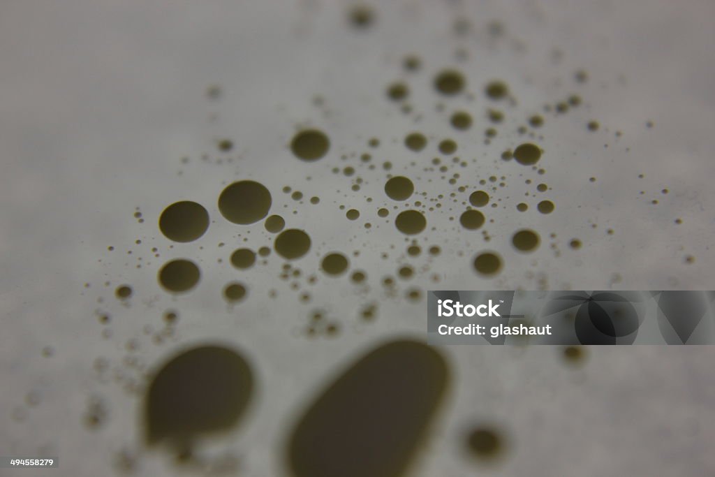 Bigger dots Milk bubbles on a white sheet of paper. Backgrounds Stock Photo