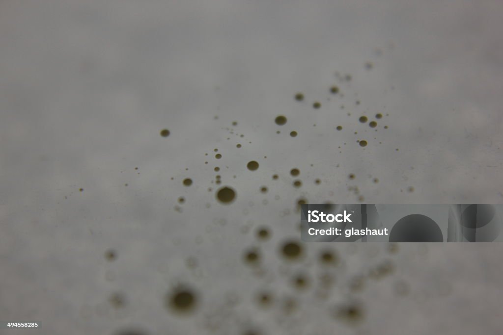 Dotting Milk dots on awhite sheet of paper. Backgrounds Stock Photo
