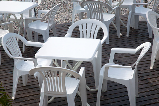 Changsha, China - August 30, 2023: Empty tables and chairs in a street restaurant