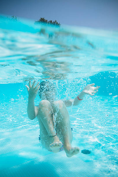 istock Jump to the Swimming Pool 494558947