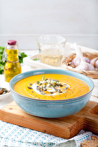 istock Roasted pumpkin and carrot soup with cream . 494559252