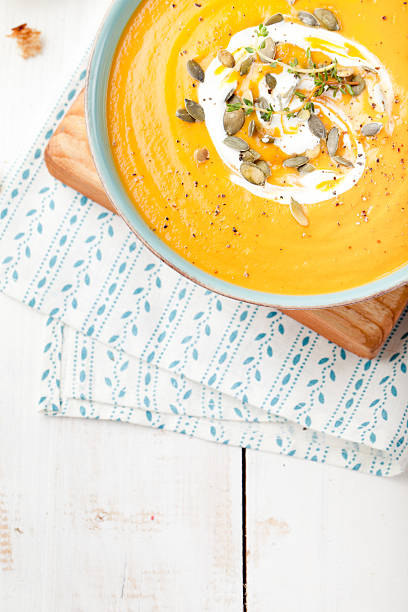 istock Roasted pumpkin and carrot soup with cream . 494559298