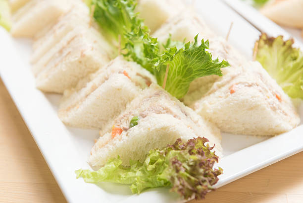 istock Freshly made of mixed sandwich triangles on wooden background. 494559692