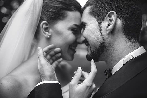 istock beautiful bride caress gently, the groom's face 494559760